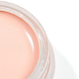 Lune+Aster swatch on skin showing pinky-peach neutralizing effect and natural finish