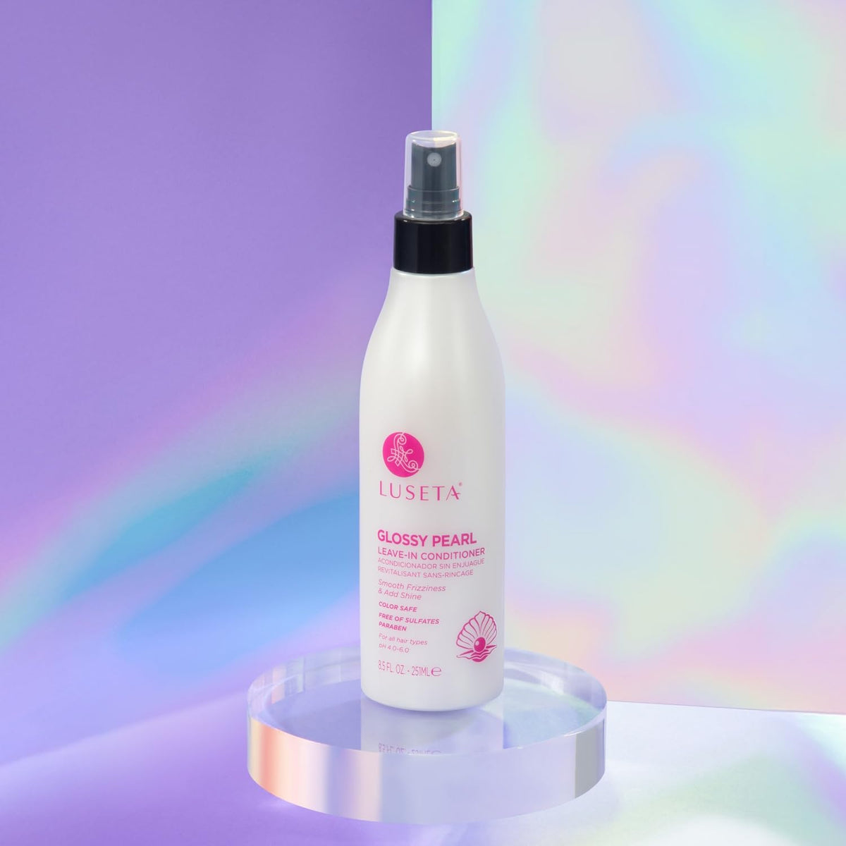 L LUSETA bottle next to hand to show true 8.5oz scale and travel convenience