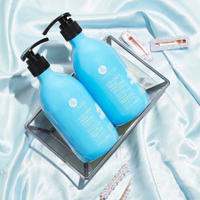 Luseta applied to wet hair at the scalp demonstrating soothing moisture