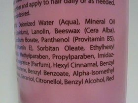 Luster's pink size comparison bottle beside common items showing 32 oz capacity