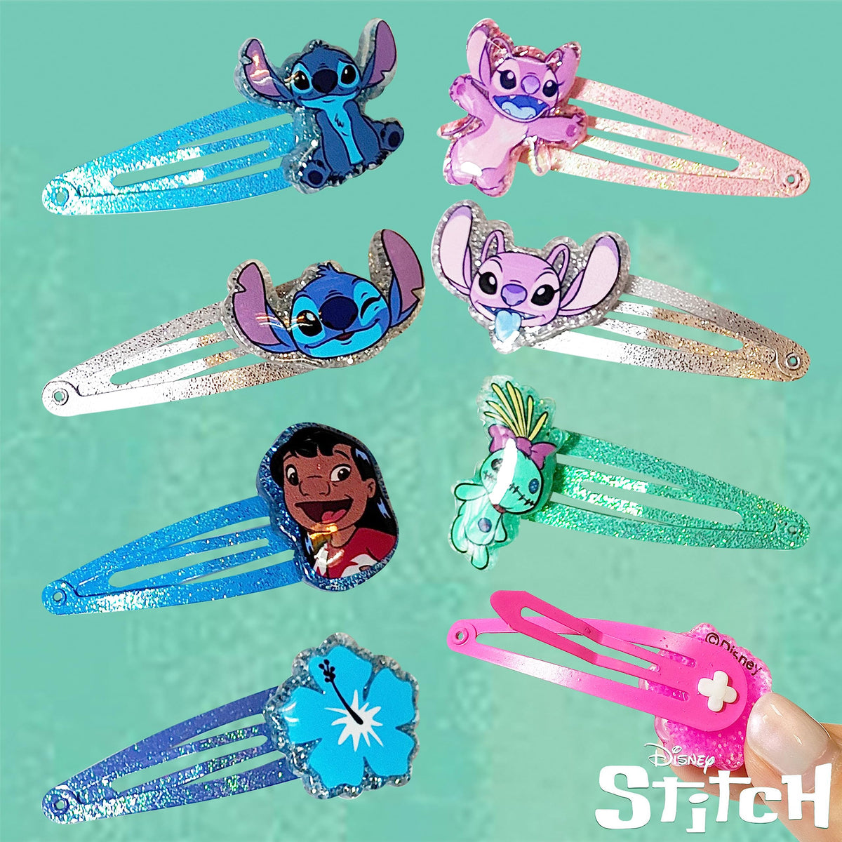 LUV HER clip held in adult hand showing compact size and portability