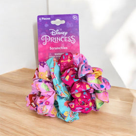 LUV HER flatlay with scrunchies and outfit pieces showing playful styling options