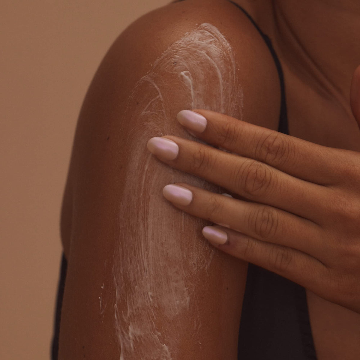 + Lux Unfiltered bottle beside self-tanner to show tan-friendly pairing benefit