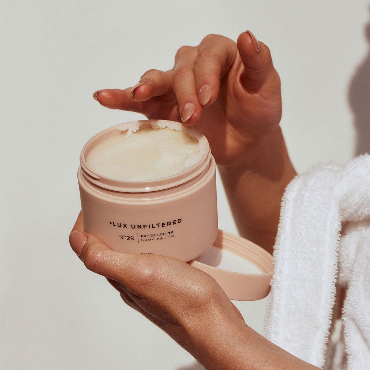 Lux Unfiltered Santal scent lifestyle scene adding warm fragrant ritual