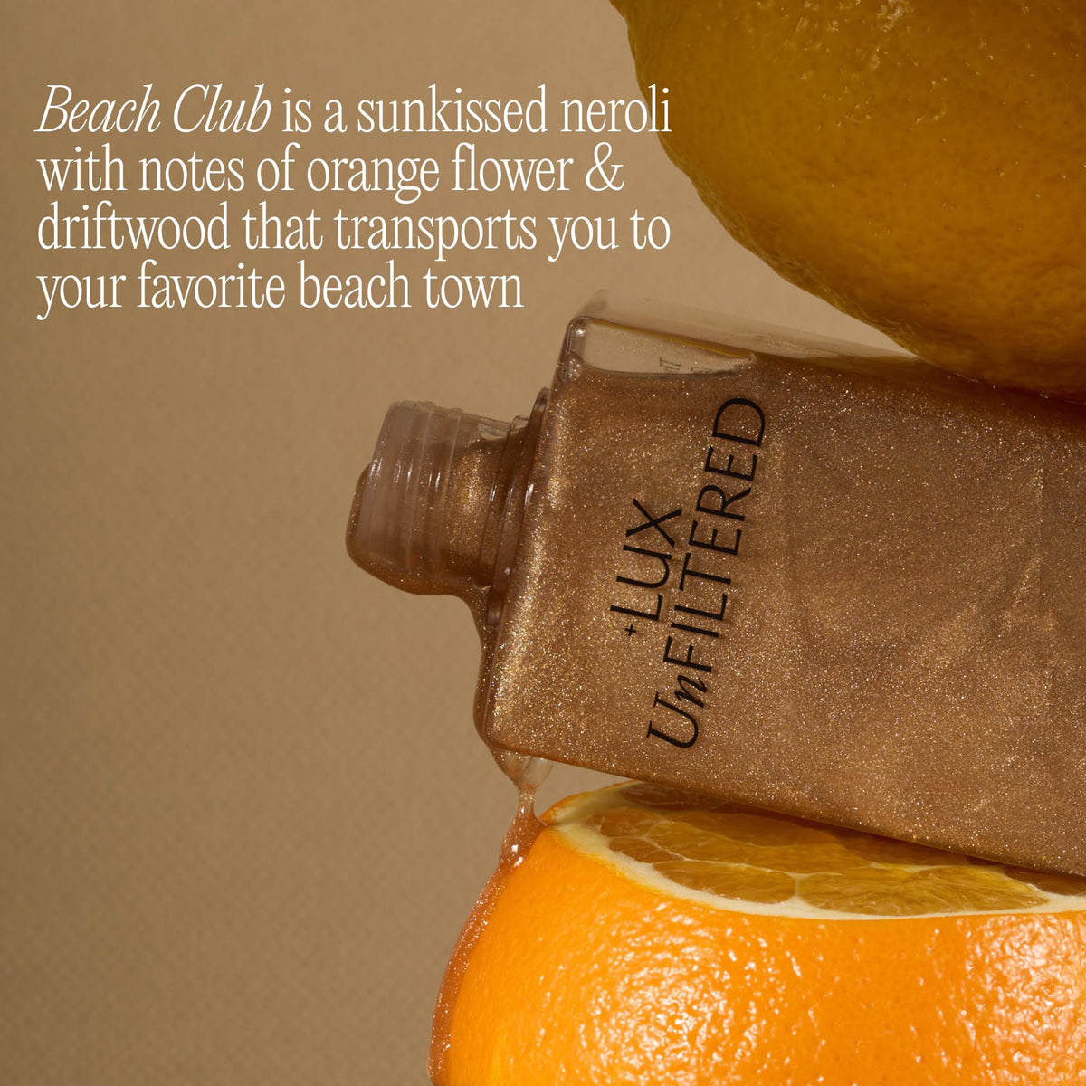 Lux Unfiltered bottle in beach setting evoking sun-kissed scent and mood