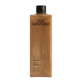 Lux Unfiltered front bottle view showing bronzed oil and glossy finish benefit