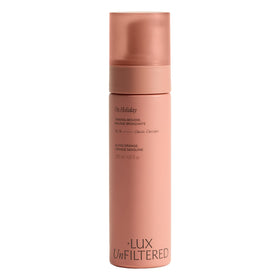 Lux Unfiltered bottle front view showing sleek packaging and tanning benefits