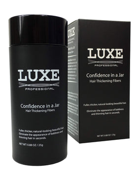 LUXE Professional jar front view showing dark brown fibers and compact packaging benefit