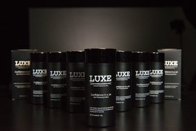 LUXE Professional jar in travel pouch showing portability and on-the-go touch-up benefit