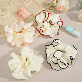 LXUEJIE four scrunchies laid flat showing color variety and elegant finish