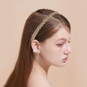 LYroo headbands beside a hand showing scale for true fit