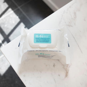 m-61 cloth pulled from pack demonstrating easy one-handed dispensing for quick use