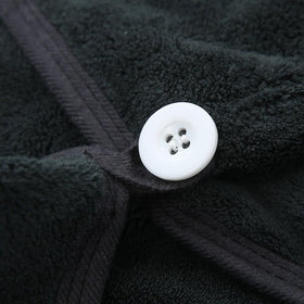 M-bestl towel beside hand for scale showing 25x65 cm size and suitability for long hair