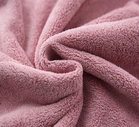 M-bestl woman wearing towel wrap after shower demonstrating hands-free drying benefit