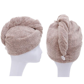 M-bestl wrap worn by curly-haired model in bathroom showing hands-free drying convenience