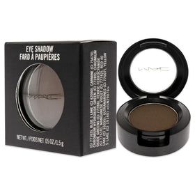 MAC Brun beside a ruler demonstrating compact 0.0455 oz size for travel convenience