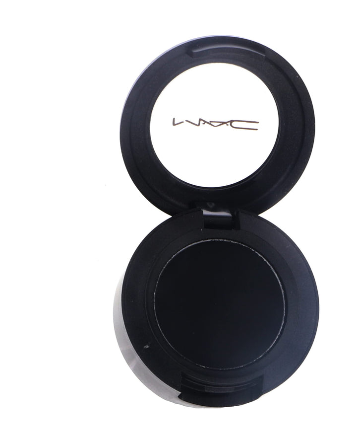 MAC Carbon front pan showing deep matte black pigment and clean packaging benefit: clear color reference