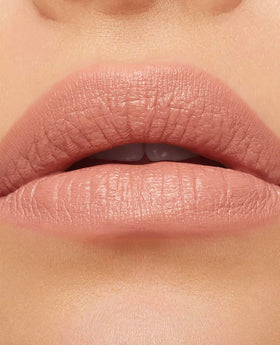 MAC Honeylove applied on lips showing full-coverage rose shade and hydrated look
