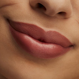 MAC Hug Me on lips closeup demonstrating natural nude finish and flattering effect