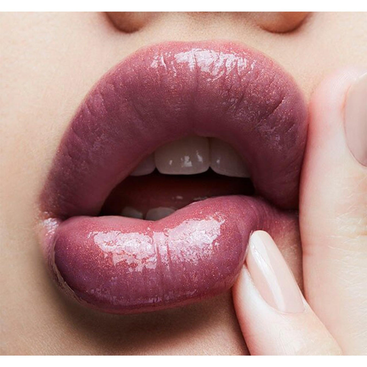 MAC LOVECHILD applied on lips demonstrating high-shine finish and enhancement benefit