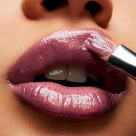 MAC LOVECHILD tube close-up displaying glossy texture and color benefit