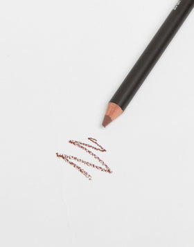 MAC mahogany flat lay with lipstick and brush showing layering versatility benefit