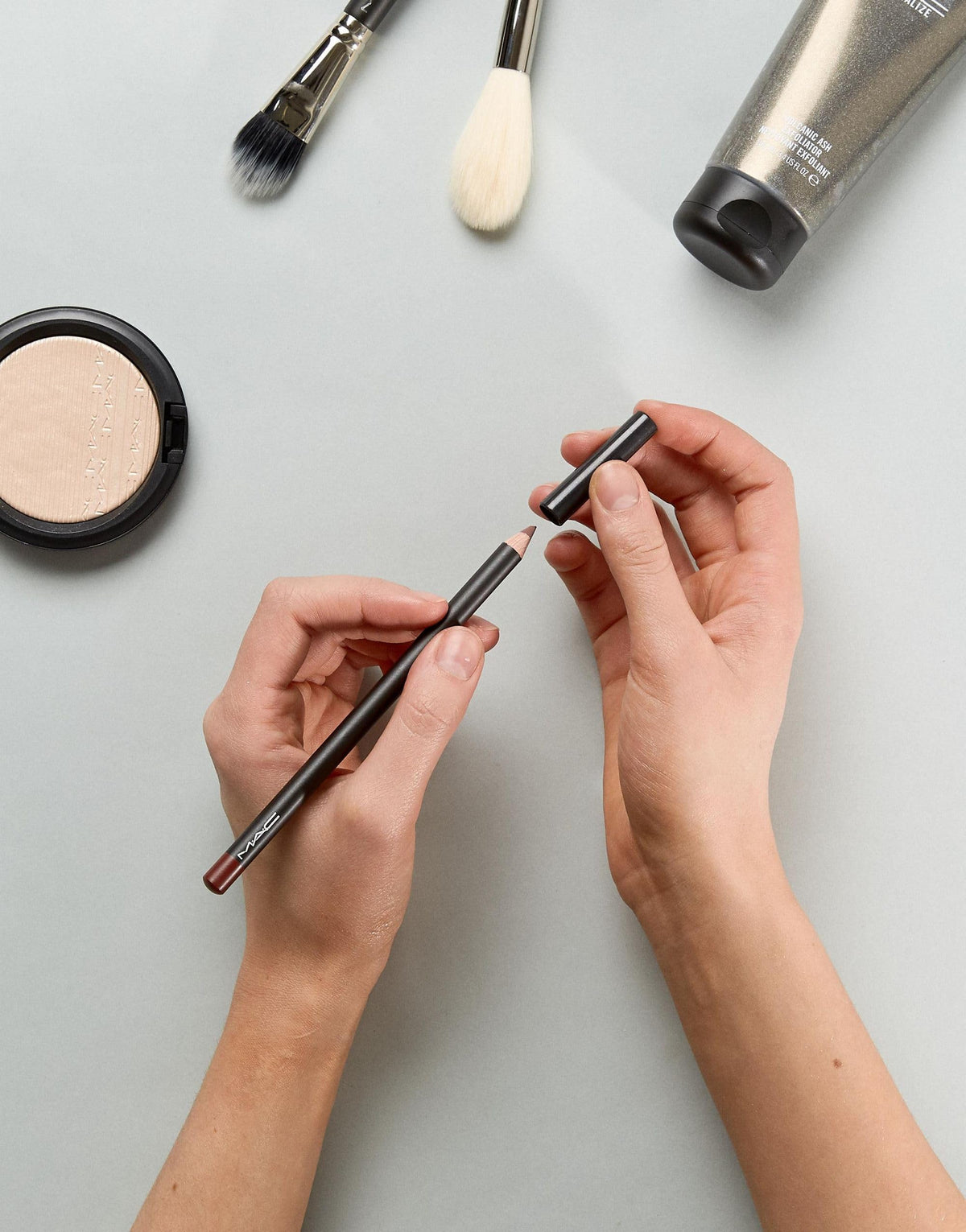 MAC mahogany worn by model in lifestyle shot showing defined finished look benefit