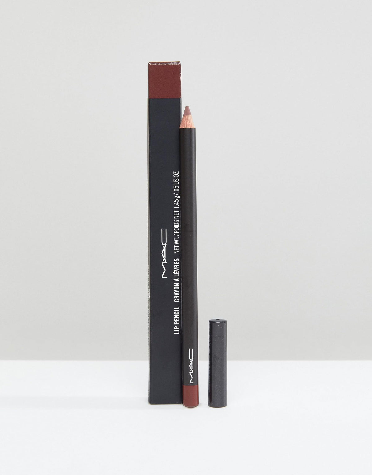 MAC mahogany pencil tip close-up highlighting precise application benefit