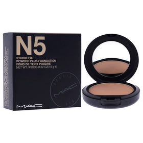 MAC Studio Fix brush applying powder to skin, demonstrating buildable coverage and even application
