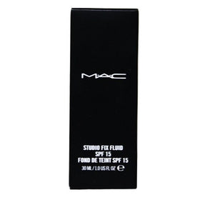 MAC Studio Fix Fluid 30ml bottle beside coin for size reference and portability