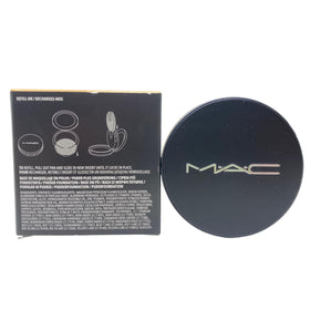 M·A·C compact in hand to show size and portability for on-the-go oil control