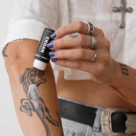 Mad Rabbit balm tucked into a pocket illustrating on-the-go protection and quick touch-ups