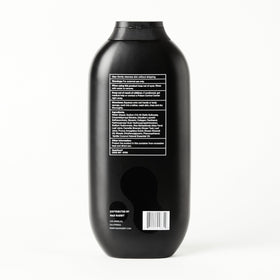 Mad Rabbit bottle styled on bathroom shelf, promotes daily routine