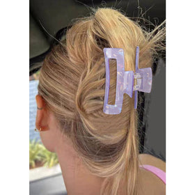 Magicsky clip securing an updo on model showing stylish hold and day-to-night use