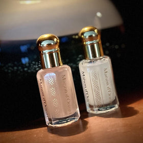 Maison d'Orient applying oil to wrist demonstrating targeted pulse-point scent and lasting benefit