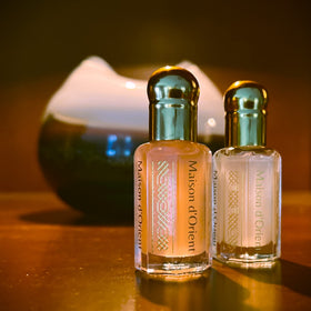 Maison d'Orient vial in hand for scale showing portable 6mL convenience benefit