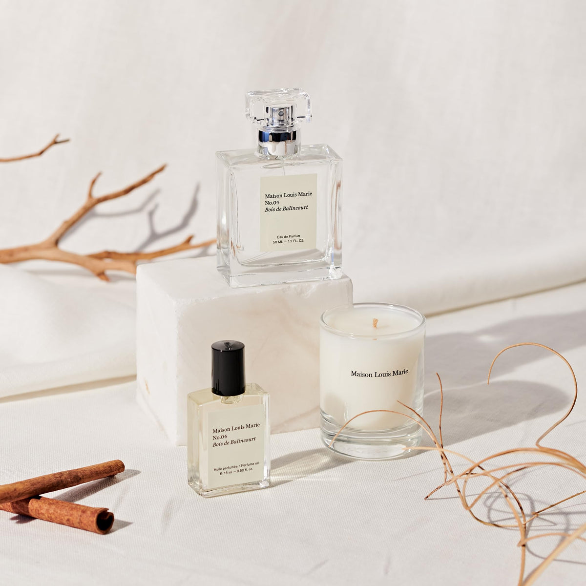Maison Louis Marie flatlay with sandalwood and vetiver elements showing fragrance note inspiration