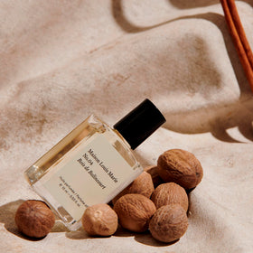 Maison Louis Marie perfume oil droplet on skin texture showcasing concentrated moisturizing oil