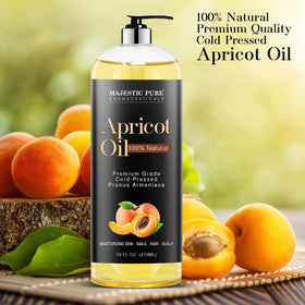 Applying Majestic Pure oil to scalp demonstrating nourishment and reduced dryness benefit
