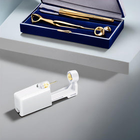 makalong scale comparison with coin illustrating compact portable kit size
