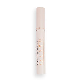 Makeup Revolution tube in hand showing compact 0.47 fl oz size for travel convenience