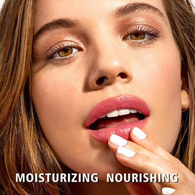 MAKI YIKA swiped on lips closeup showing natural nude-pink tint and hydration