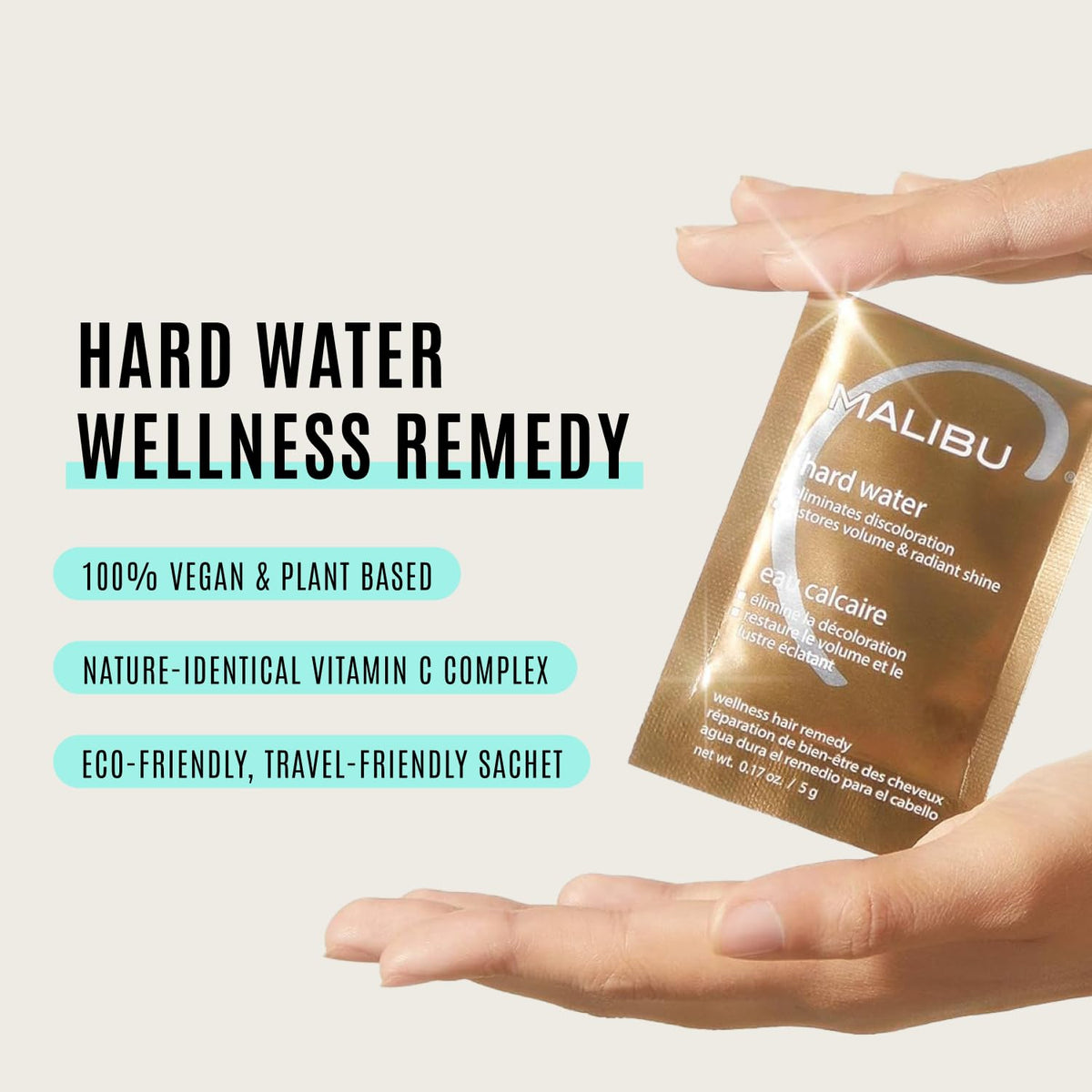 Malibu C applying dissolved packet to wet hair demonstrating easy in-shower use