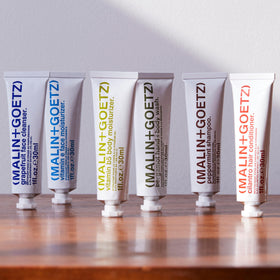 MALIN+GOETZ aluminum tube detail highlighting recyclable packaging benefit