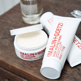 MALIN+GOETZ on bathroom counter styled in lifestyle setting for everyday grooming appeal