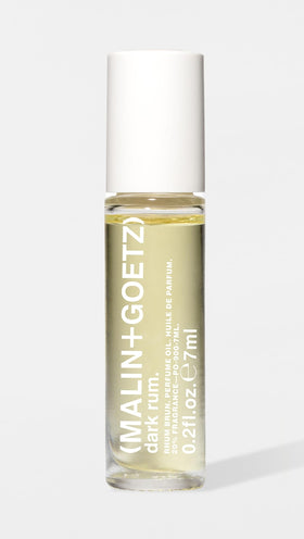 MALIN+GOETZ Dark Rum rollerball cap and label detail highlighting premium finish and clear branding