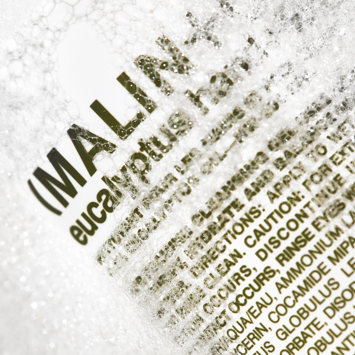 MALIN+GOETZ label detail with ingredients list showing transparent formulation benefit