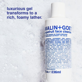 MALIN+GOETZ close-up of label highlighting grapefruit and vegan claims for ingredient transparency