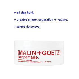 MALIN+GOETZ jar in hand to show compact 2 oz scale and travel-friendly convenience