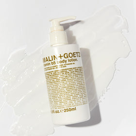 MALIN+GOETZ lotion texture on hand demonstrating fast absorption and lightweight feel